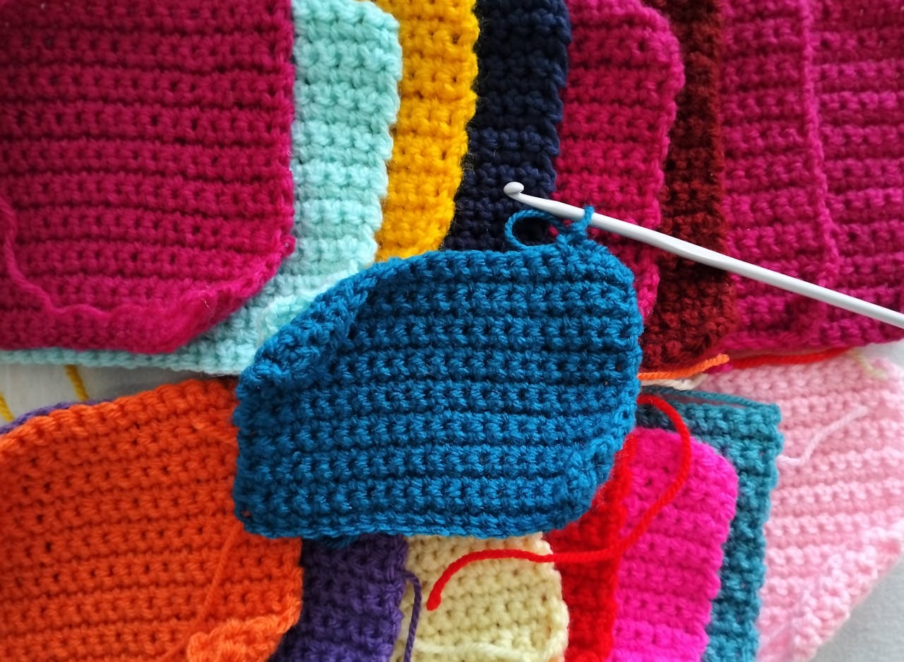 Learn Crochet Easily for Beginners Bright and vibrant crochet squares in various colors with a crochet hook.